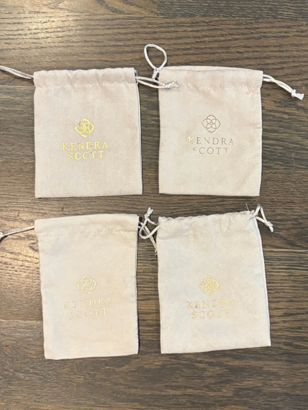Kendra Scott Light Beige Drawstring Jewelry Pouches with Gold Logo - Set of 4